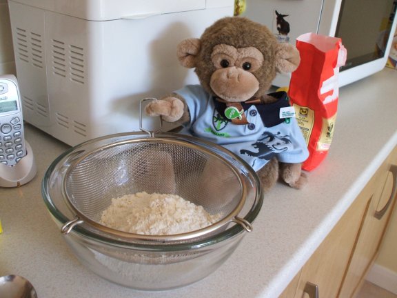 Jimby sifts the flour
