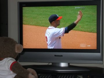 Is he waving to me on a big screen?